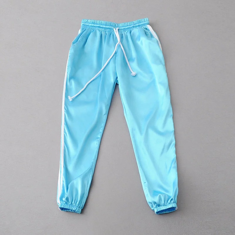 blue joggers with white stripe